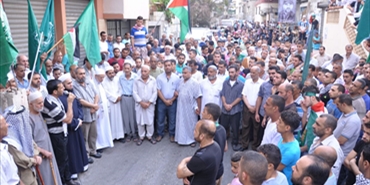 مسيرة حاشدة لحماس في مخيم برج الشمالي تأييدا للمقاومة في غزة صبيحة يوم العيد