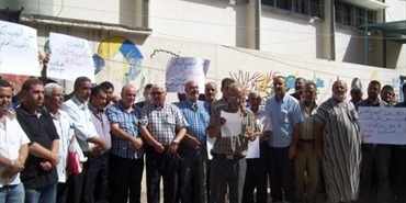 اعتصام احتجاجي على سياسة الانروا بقطع المعونة عن النازحين الفلسطينين