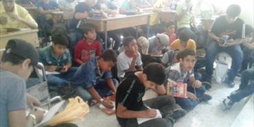 طلبة مخيم اليرموك يبدأون عامهم الدراسي جنوب دمشق رغم المعوقات الكبيرة